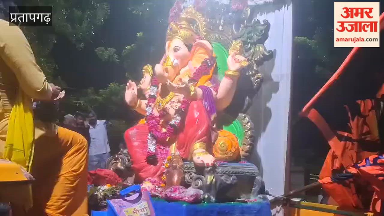 Devotees immersing an idol in an artificial water body in Manikpur.
