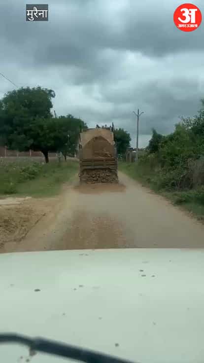 Sand rained down on the highway as the police gave chase; the driver fled after scattering sand across road