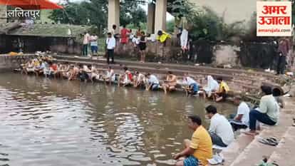 Chants of *Tarpan* mantras resonate as *Pitru Paksha* begins; crowds throng the riverbanks.