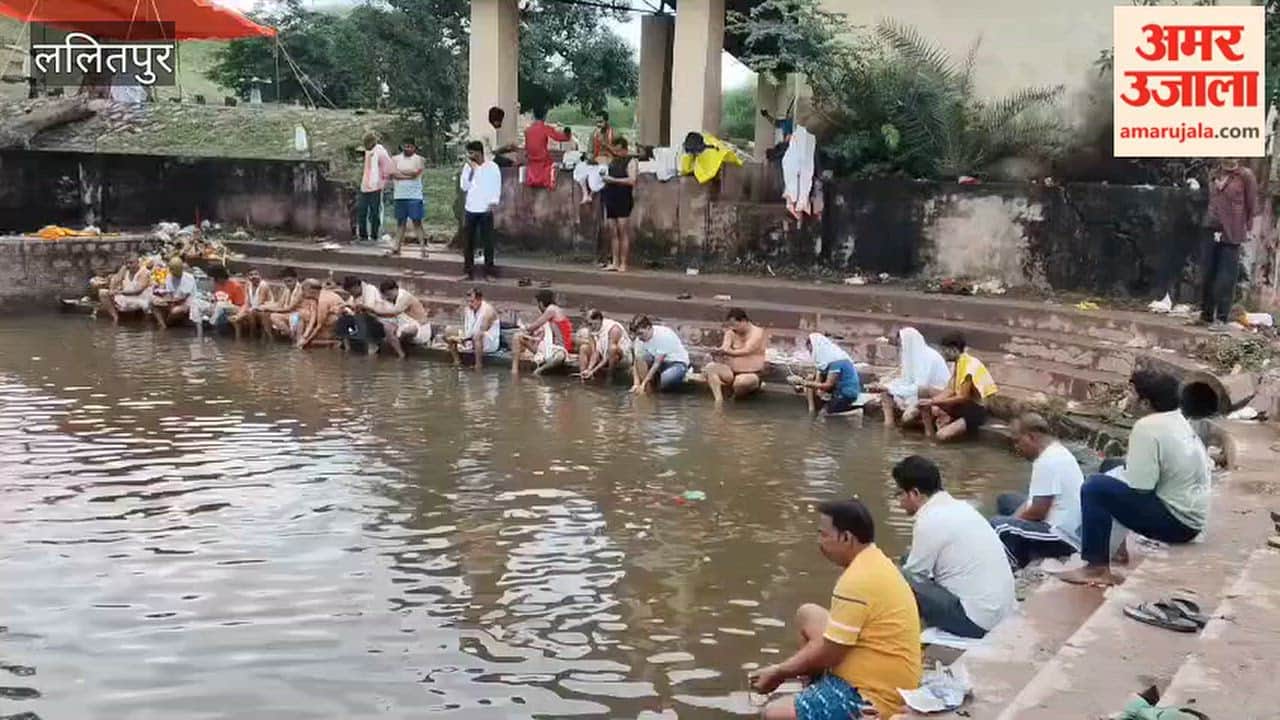 Chants of *Tarpan* mantras resonate as *Pitru Paksha* begins; crowds throng the riverbanks.
