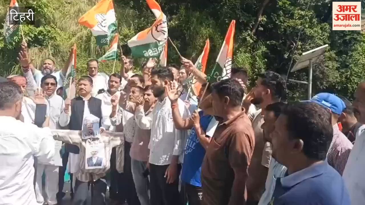 Congress workers protest in Kirtinagar register protest by burning effigies of the Chief Election Commissioner