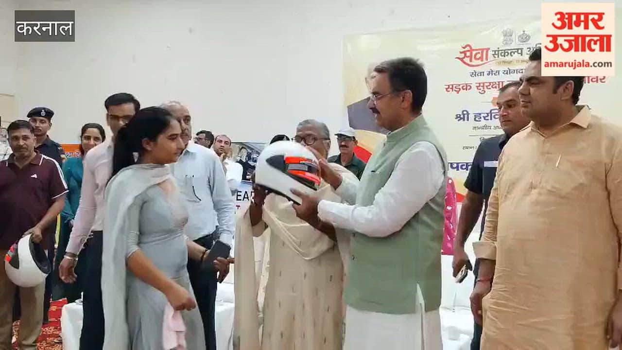 Road safety campaign in Gharaunda; employees made aware through helmet distribution.