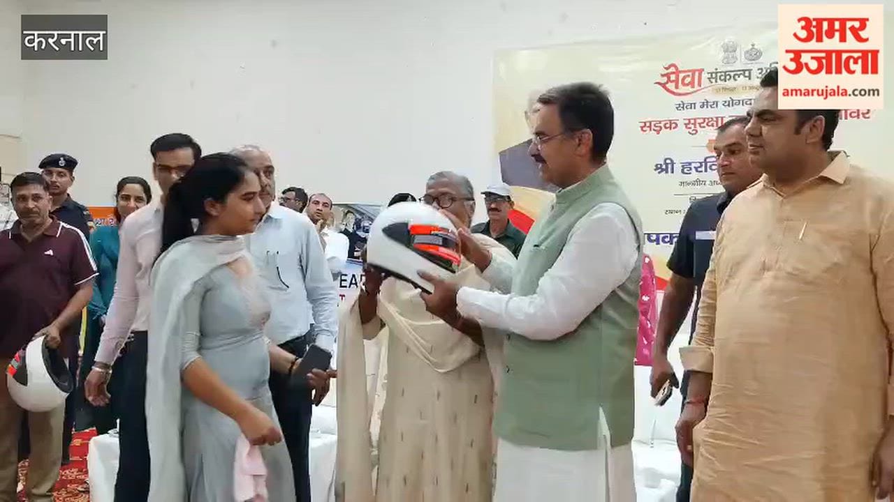 Road safety campaign in Gharaunda; employees made aware through helmet distribution.