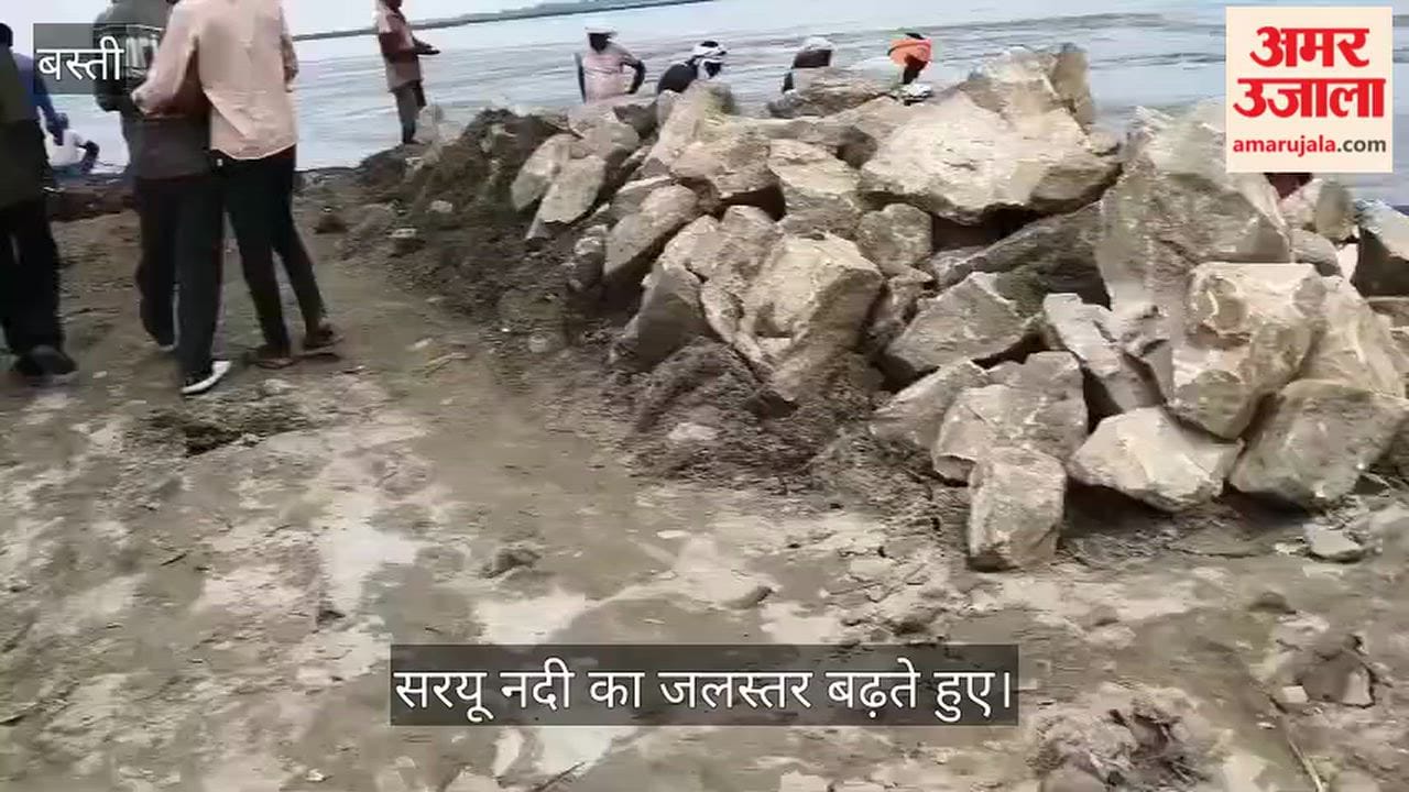 Saryu in spate; villagers struggling to prevent erosion.