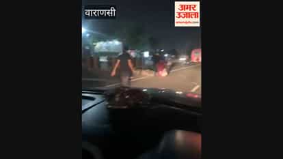 Two injured after being hit by an unidentified truck; carried away using a cloth wrap