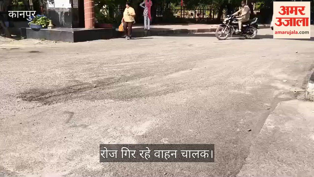 Poor road conditions near Manekshaw Gate in Kanpur Cantt Crumbling surface and scattered gravel