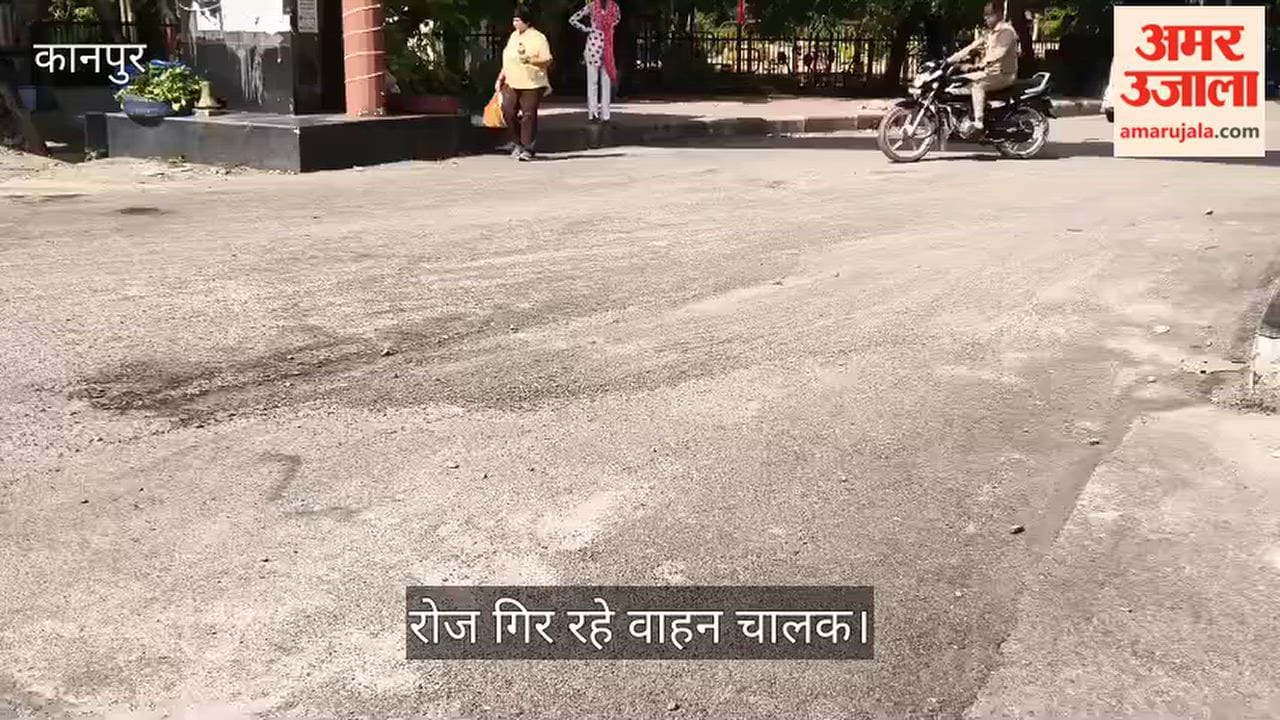 Poor road conditions near Manekshaw Gate in Kanpur Cantt Crumbling surface and scattered gravel