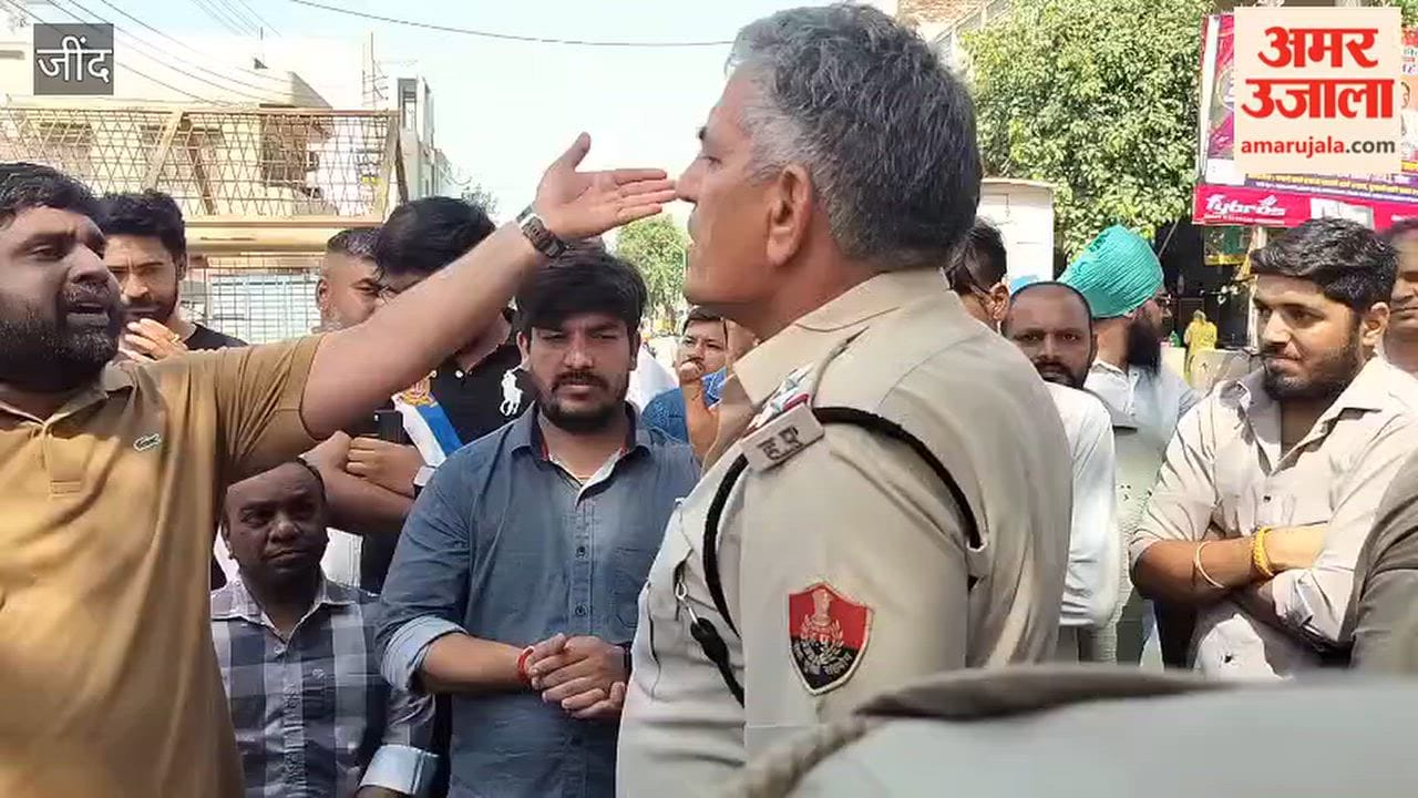 Shopkeepers block the road at Jind's Safidon Gate in protest against the incomplete roadwork; business has been affected for two months.