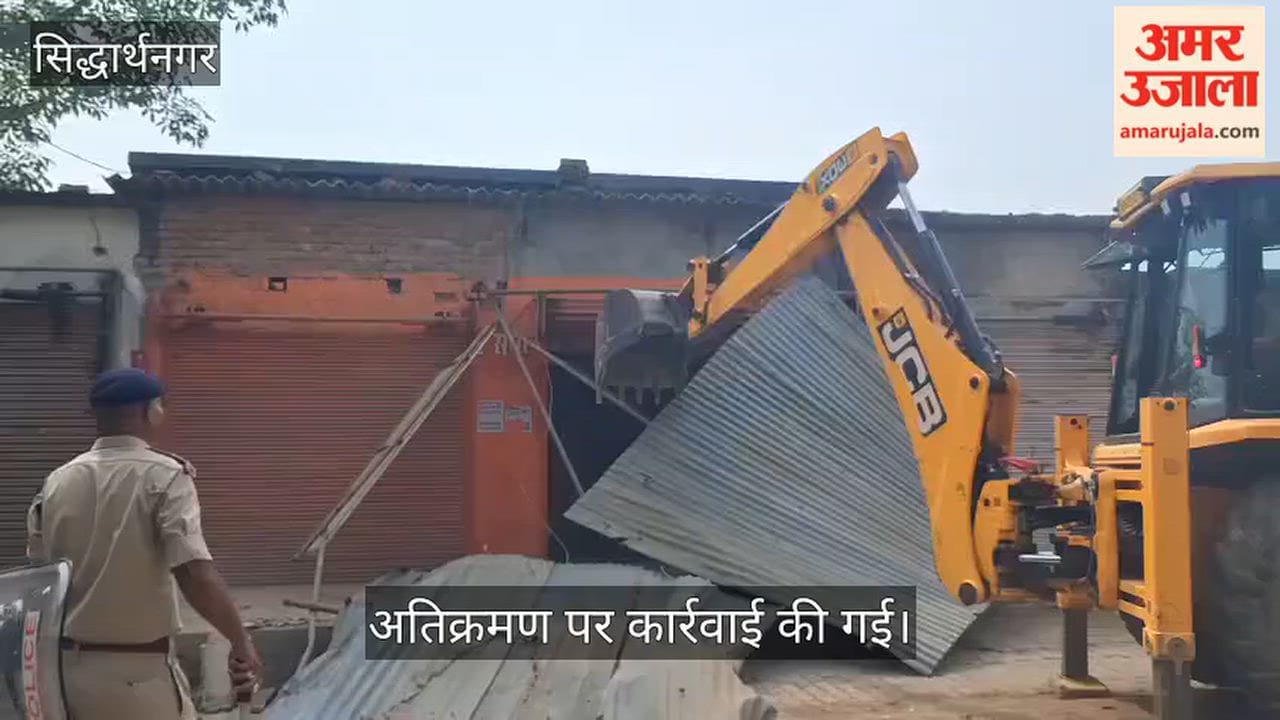 Railway's bulldozer rolls over encroachments.