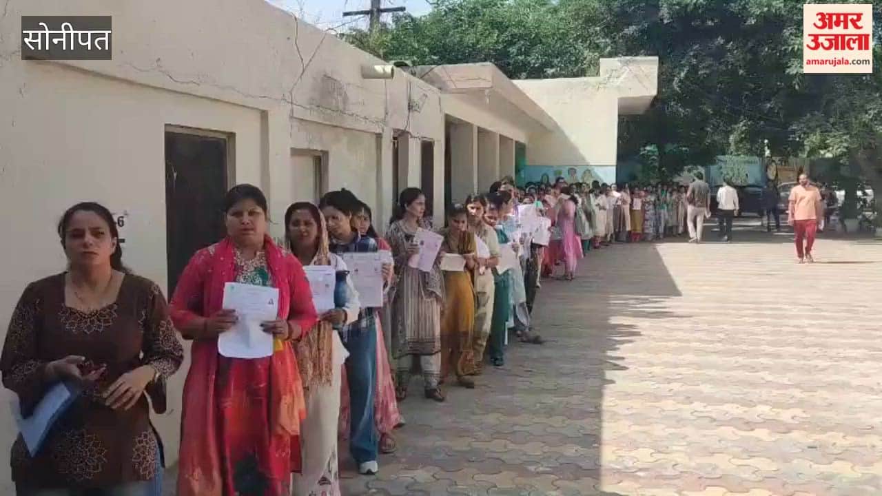 Biometric verification for HTET candidates is underway in Sonipat; one out of four machines is out of order.