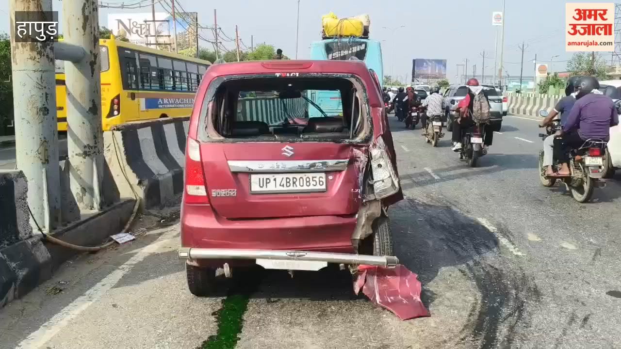 Car damaged in collision with bus on highway driver safe