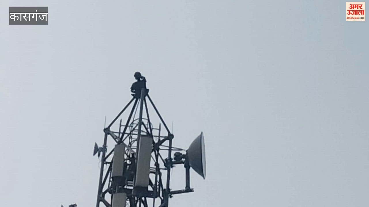 Upset over land not being transferred to his name, a young man climbed a tower; police brought him down safely.