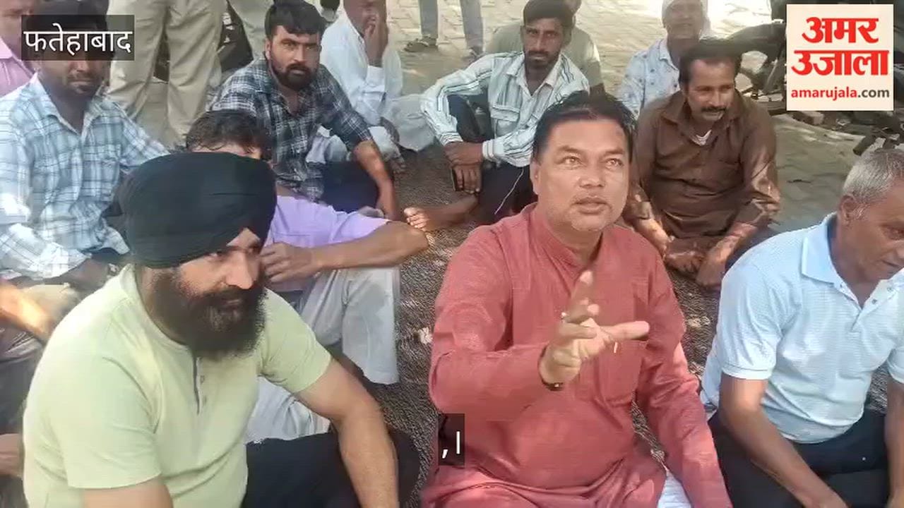 Employees stage a sit-in demanding a revised pay scale; block the vehicle of officials heading to a meeting with the DC.