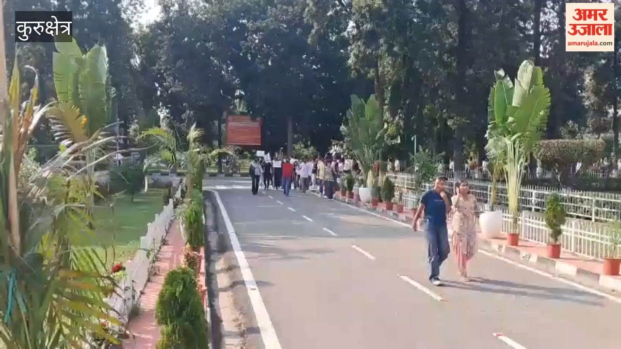 Students and teachers at Kurukshetra University took to the streets to protest the assault on a professor, blocking the area outside the Vice-Chancellor's office.