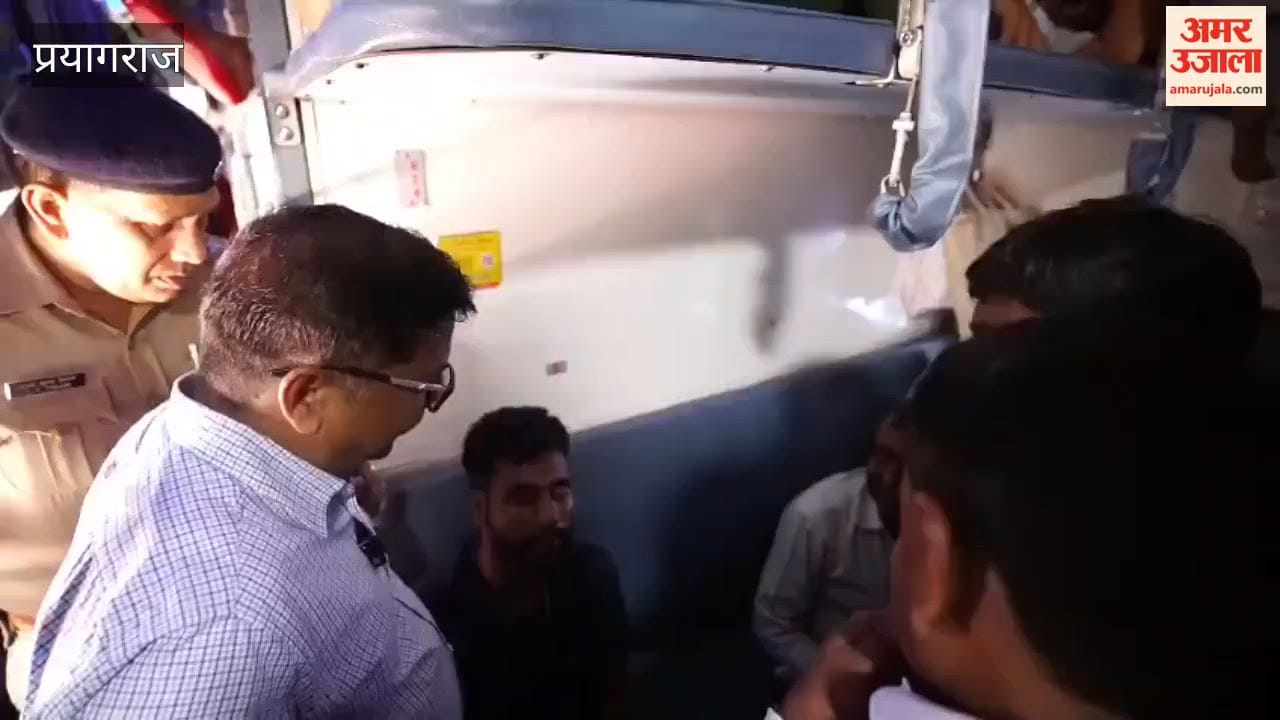 DRM Nareshpal Singh collecting feedback from passengers in a general coach of the Jammu Mail at Subedarganj railway station.
