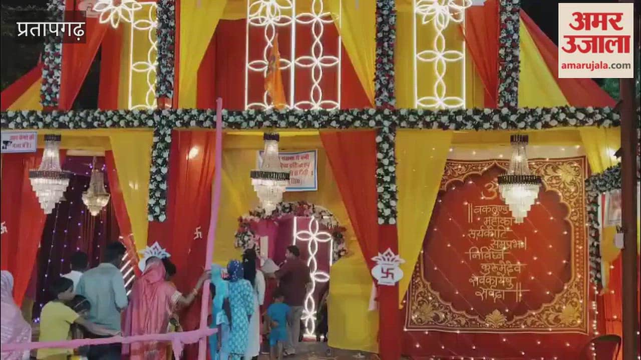 Durga Puja pandal decorated with a theme centered on Maa Vaishno Devi, featuring displays made of kidney beans (rajma) and peanuts.