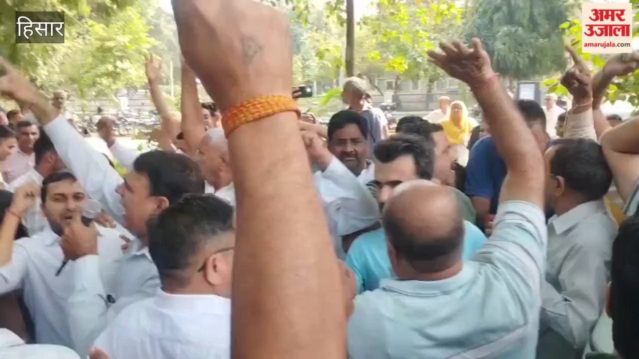Colony residents arrived to stage a protest in front of the electricity department staff.