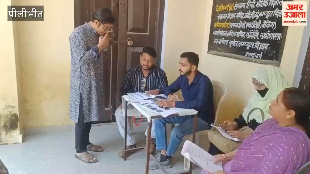 voters arrive to check the status of their details in Budaun